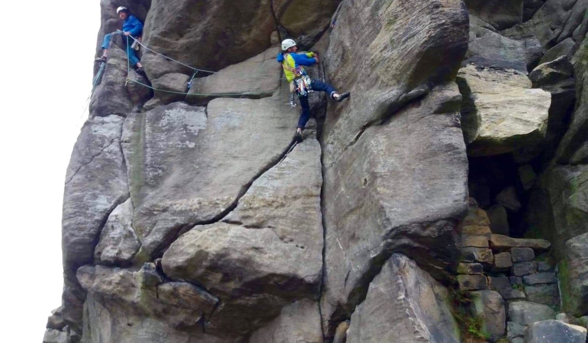 guys climbing at almscliff traverse rock climbing