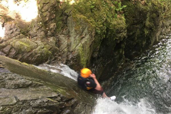 canyoning slide on church beck ghyll scramble